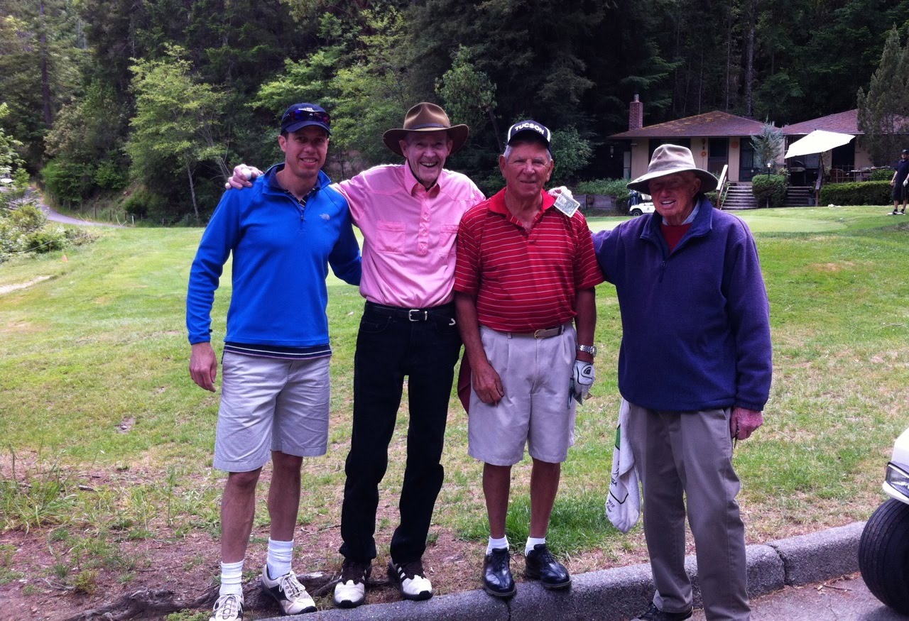 Four golfers together on the course